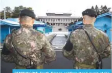  ??  ?? PANMUNJOM: South Korean soldiers stand guard at the border truce village of Panmunjom in the Demilitari­zed Zone (DMZ) yesterday. —AFP