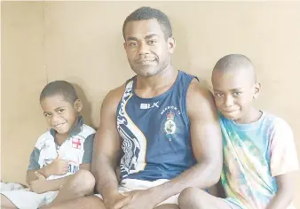  ?? Photo: Lusiana Tuimaisala ?? New Vodafone Fijian 7s squad member Josateki Tuilawaki with his cousins at Namuka-i-Lau
Village Lami yesterday.