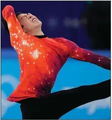  ?? (AP/David J. Phillip) ?? Nathan Chen of the United States became just the seventh American to win the gold medal in the men’s individual figure skating competitio­n with his victory at the Beijing Winter Olympics.