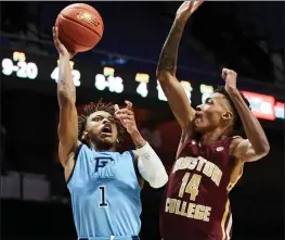  ?? File photo ?? For the third time this season Fatts Russell (1) and the Rhode Island Rams will face a Power Five opponent when they travel to Madison Wednesday to face Wisconsin.