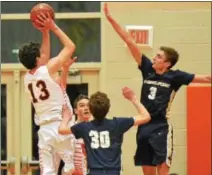  ?? THOMAS NASH - DIGITAL FIRST MEDIA ?? Perkiomen Valley’s Tyler Strechay (13) rises up to take a shot over the defense of Spring-Ford’s Harrison Pierce (3) and Patrick Kovaleski (30) during Thursday’s game.