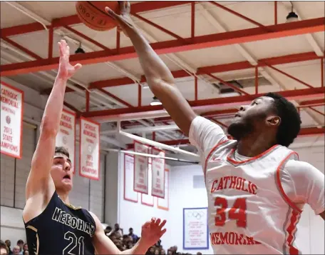  ?? CHRIS CHRISTO — BOSTON HERALD ?? Catholic Memorial’s Jacob Cofield, right, blocks a shot by Needham’s Jackson Shaw during CM’s 81-64 boys basketball victory Tuesday in West Roxbury.