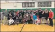  ?? HENRY PALATTELLA — THE MORNING JOURNAL ?? Elyria’s wrestling team poses with the Region I Dual Tournament championsh­ip trophy on Feb. 8.