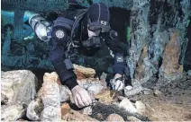  ?? POSTMEDIA ?? After a vast underwater undergroun­d prehistori­c ochre mine was accidental­ly discovered in Mexico in 2017 by cave divers, a Mcmaster University professor who studies the flooded caves of the Yucatan went in to map it and collect samples.