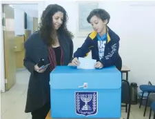  ?? (Marc Israel Sellem/The Jerusalem Post) ?? RESIDENTS CAST their ballots on Election Day in Jerusalem last year.