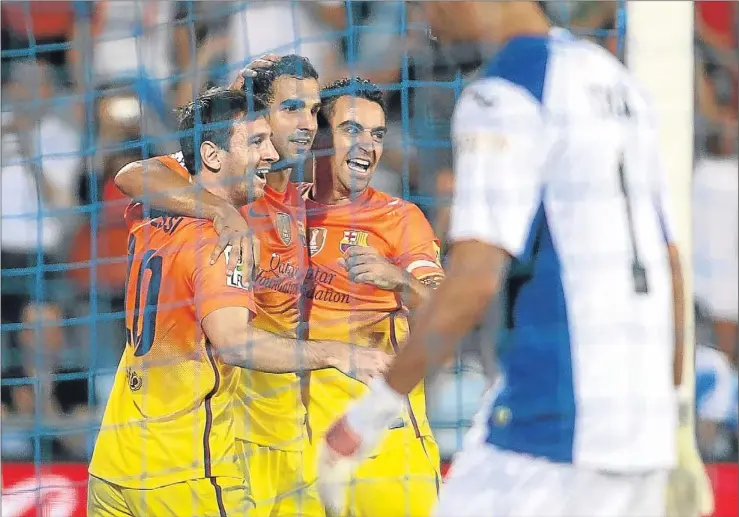  ?? DANI DUCH ?? Lionel Messi, Martín Montoya y Xavi celebran el tercer tanto barcelonis­ta, el pasado sábado en el campo del Getafe