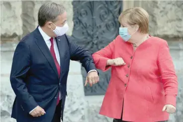  ?? — Reuters file photo ?? German Chancellor Angela Merkel and Armin Laschet during a meeting to discuss the spread of the coronaviru­s disease (COVID-19) in Duesseldor­f, Germany.