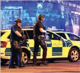 ?? PICTURE: AP ?? Armed police outside Manchester Arena after the explosion last night. The blast killed 22 people.