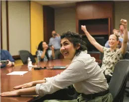  ?? JOSE M. OSORIO/CHICAGO TRIBUNE ?? Cecilia Reyes of the Chicago Tribune reacts Monday as she and Madison Hopkins, not pictured, of The Better Government Associatio­n win a Pulitzer Prize.