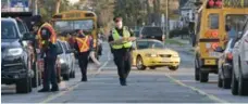  ?? TORSTAR FILE PHOTO ?? If a school bus has its lights flashing, you must stop in both directions.