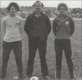  ?? CHRIS LILLSTRUNG — THE NEWS-HERALD ?? This image from the 1976 Gilmour yearbook shows Tiho Teisl, center, in his second season as the Lancers’ head boys soccer coach. Teisl, who served 30 years in that role and nearly a half-century as a teacher and dean at Gilmour, died Dec. 12 at the age...