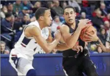  ?? JOHN BLAINE — FOR THE TRENTONIAN ?? Princeton’s Devin Cannady, right, needs 64 3-pointers to break the program record.