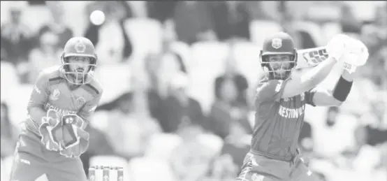  ??  ?? Man-of-the-Match Shai Hope goes on the attack during his top score of 77 for West Indies in their World Cup match at Headingley yesterday.