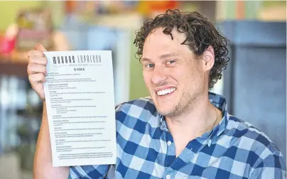  ?? PHOTO: LINDA ROBERTSON ?? Kapai . . . Modaks Espresso owner Jack Bradbury with his cafe’s new menu which has been translated into te reo Maori.