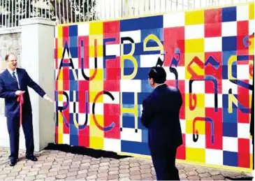  ?? SUPPLIED ?? Minister of Foreign Affairs Prak Sokhonn and German Ambassador Christian Berger unveil a mural in 2019.