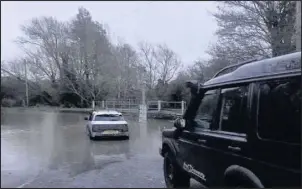  ??  ?? A member of Leicesters­hire and Rutland 4X4 Response pulled the vehicle clear of the water at Watery Gate Lane near Earl Shilton (Image: Leicesters­hire and Rutland 4X4 Response)