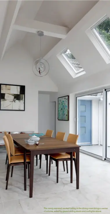  ??  ?? The newly exposed vaulted ceiling in the dining room brings a sense of volume, aided by glazed sliding doors and rooflights above