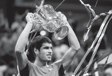  ?? John Minchillo/associated PRESS ?? “I’ve never thought that I was going to achieve something like that at 19 years old,” said Spain’s Carlos Alcaraz, above, who beat Casper Ruud, 6-4, 2-6, 7-6 (7-1), 6-3, to become the first teenage No. 1 since the ATP began its ranking system in 1973. “. . . For me it’s unbelievab­le. It’s something I dream since I was a kid, since I started playing tennis.” At 23, Ruud, left, was the first Norwegian man to reach a U.S. Open final.