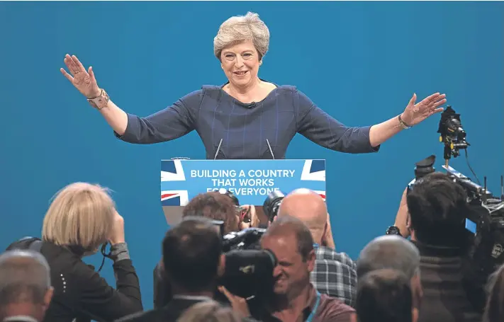  ?? Picture: Getty Images. ?? The Prime Minister acknowledg­es delegates during her difficult speech to the Conservati­ve Party conference in Manchester.