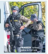  ??  ?? TRAGEDY Armed police in Co Cork