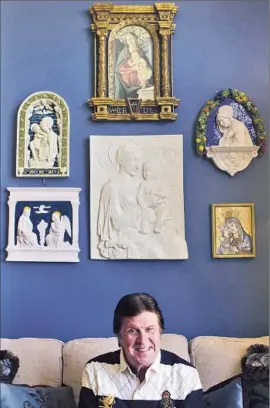  ?? Cheryl A. Guerrero
Los Angeles Times ?? POLITICAL STRATEGIST Garry South in his Marina del Rey home with some of the religious art he’s collected. He’s designed vestments for nearly 30 years.