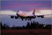  ?? JENNIFER BUCHANAN — THE SEATTLE TIMES VIA AP ?? The last Boeing 747lands at Paine Field in Everett, Wash., on Jan. 10.