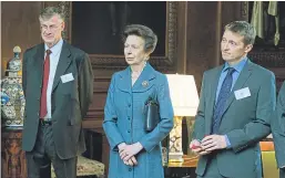  ??  ?? Clockwise from left: Mike Robinson surveys the scenery from a mountain top; with the Princess Royal at a Royal Scottish Geographic­al Society reception at the Palace of Holyroodho­use in Edinburgh; at an RSGS function.