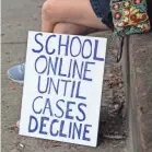  ?? LEAH VOSS/USA TODAY NETWORK ?? Parents, students, teachers and school staff members in Stuart, Fla., gathered on July 21 to protest plans to reopen classrooms. The state recently saw a spike in coronaviru­s cases.