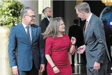  ?? ?? Canadian Finance Minister Chrystia Freeland is greeted by German counterpar­t Christian Lindner, right, and Joachim Nagel, president of the Bundesbank, at a G7 meeting near Bonn, Germany.