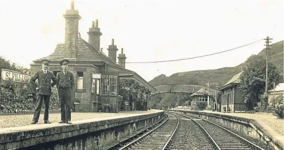  ??  ?? Station master George Maxwell and signalman Adam Ferrar, at St Fillans station in the 1930s. See more on left.