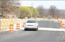  ?? LYNN KUTTER ENTERPRISE-LEADER ?? Parks Street bridge in Prairie Grove opened to two-way traffic Friday afternoon, though a few details still have to be completed, such as striping, guardrails on the approaches and clean-up. City officials plan a brief ribbon cutting when everything is...