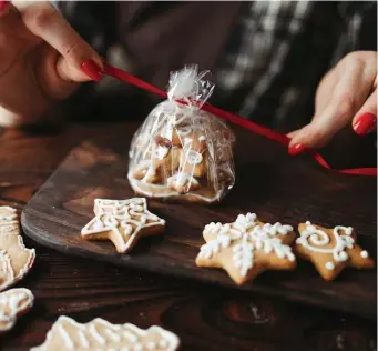  ?? Getty images ?? SHARE THE LOVE: Pack up some cookies and spread a little Christmas cheer.