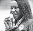  ?? ROB SCHUMACHER, USA TODAY SPORTS ?? Simone Manuel celebrates with her gold medal Thursday night.