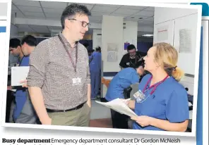  ??  ?? Busy department Emergency department consultant Dr Gordon McNeish and advanced clinical practition­er Karen Johnstone at the busy department
