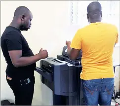  ?? ?? Maseko (L) printing an assignment yesterday morning at around 9am. at the university