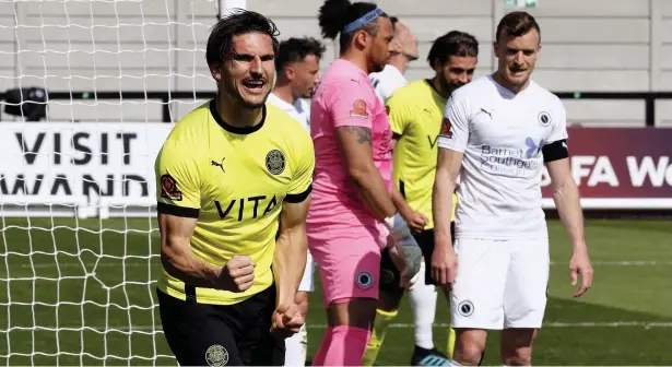  ?? Www.mphotograp­hic.co.uk ?? ● Ash Palmer celebrates after scoring the opening goal in County’s 3-0 win at Boreham Wood on Saturday