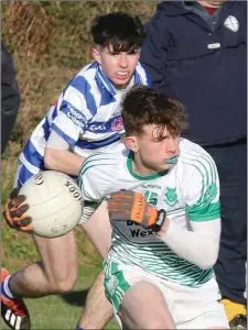  ??  ?? Paul Hearne of St. Peter’s has Oisín Doyle watching his every move.