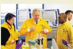  ??  ?? TESTING Boris Johnson at lab yesterday