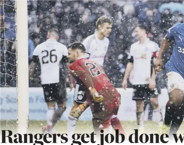  ??  ?? 0 With the snow coming down at Somerset Park, Alfredo Morelos wheels away in delight at scoring his second and Rangers’ fifth. Right, a tattooed Jason Cummings is mobbed by his team-mates after giving the hosts the lead for the first time in the match....