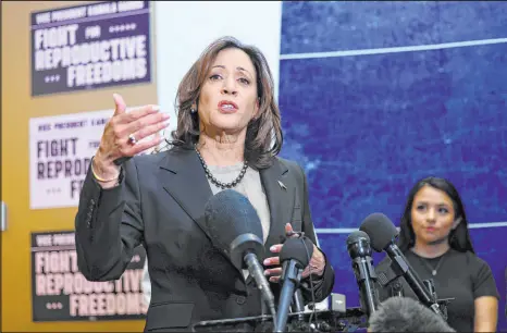  ?? Adam Bettcher The Associated Press ?? Vice President Kamala
Harris speaks Thursday at a Planned Parenthood center in
St. Paul, Minn., about “silently suffering” women who can’t get an abortion.