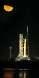  ?? NASA/BILL INGALLS ?? RISING DESTINATIO­N. The Moon shines over the Space Launch System and Orion spacecraft stacked at Launch Pad 39B at the Kennedy Space Center Nov. 14.