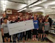  ?? PHOTO COURTESY OF AVON LAKE CITY SCHOOLS ?? Students and staff at Learwood Middle School were recently presented with a $5,000 check from the Cleveland Clinic Regional Health System for winning first place in the 2018 Youth MOVement Contest.