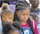  ?? BARBARA HADDOCK TAYLOR/BALTIMORE SUN ?? Shanika Robinson, mother of Taylor Hayes, listens during a moment of silence during a peace walk held in the girl’s honor.