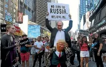  ?? PHOTO: REUTERS ?? A demonstrat­or takes part in a protest in New York City’s Times Square against US President Donald Trump’s announceme­nt that he plans to reinstate a ban on transgende­r individual­s serving in the US military.