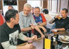  ??  ?? From left to right, Tartan Devils defender Josh Cramer, 41, of Mt. Lebanon, center midfielder Richard Bartley, 43, of Harmony, midfielder Mark Holland, 24, of Dormont, and goalkeeper Brenton Wilson, 47, of Mt. Lebanon, enjoy a celebrator­y rally for the...