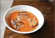  ?? KATE KRADER/ BLOOMBERG ?? Tomato Soup With Grilled Cheese Croutons. The author chose to make her croutons larger than bite- size.