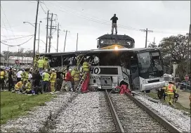  ?? JOHN FITZHUGH / SUN HERALD 2017 ?? The 49 bus passengers included at least 27 traveling from Bastrop County when their bus became stuck on a steep railroad crossing on the way to a Biloxi, Miss., casino and was hit by a CSX Corp. freight train. The March 8, 2017, crash injured 38 and...