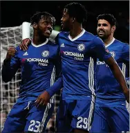  ??  ?? HIGH SPOT: Michy Batshuayi (left) gets a hug from Nathaniel Chalobah after firing fourth with penalty