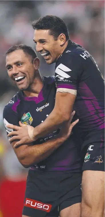  ??  ?? PURE JOY: Melbourne’s Cameron Smith and Billy Slater celebrate one of Slater’s two tries.