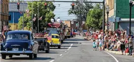  ?? CONTRIBUTE­D ?? The streets were lined with spectators during the 2019 Memorial Day Parade in Middletown. This year’s parade is set for May 30.